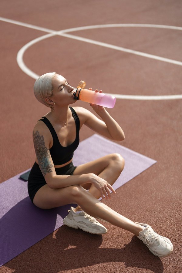 What are the best practices for preventing dehydration during summer football matches in the UK?