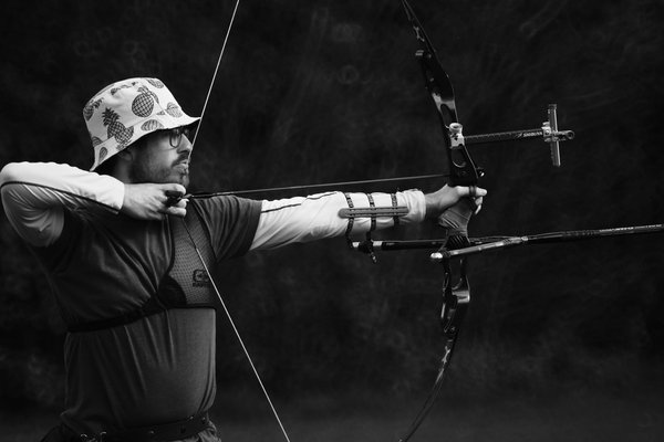 What is the most effective breathing technique for precision in archery competitions?